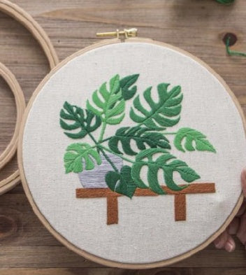 Cross stitch of green plants